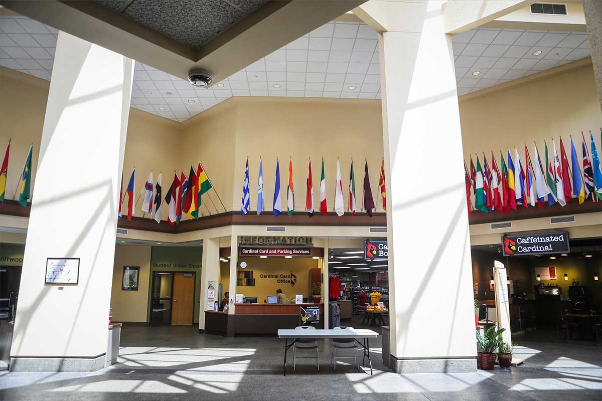 Interior shot fo the student union building with different national flags