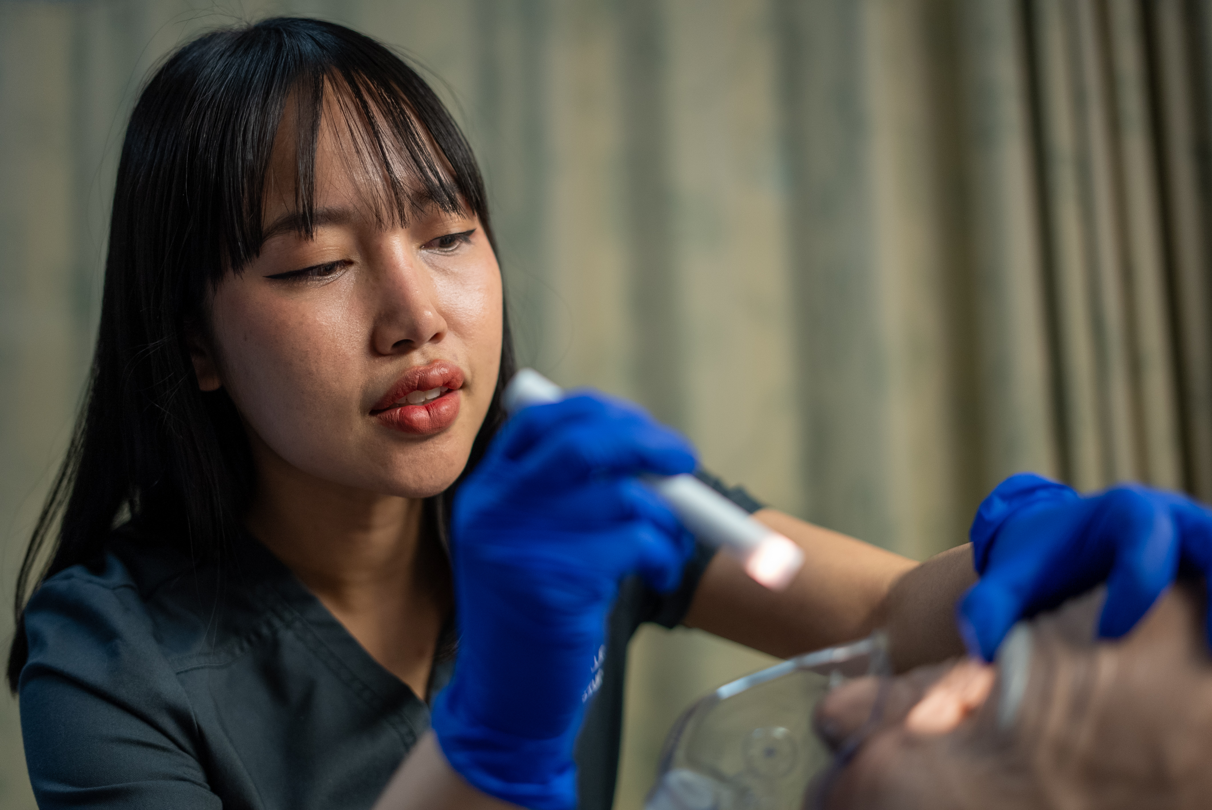 Nursing student doing patient skills on person