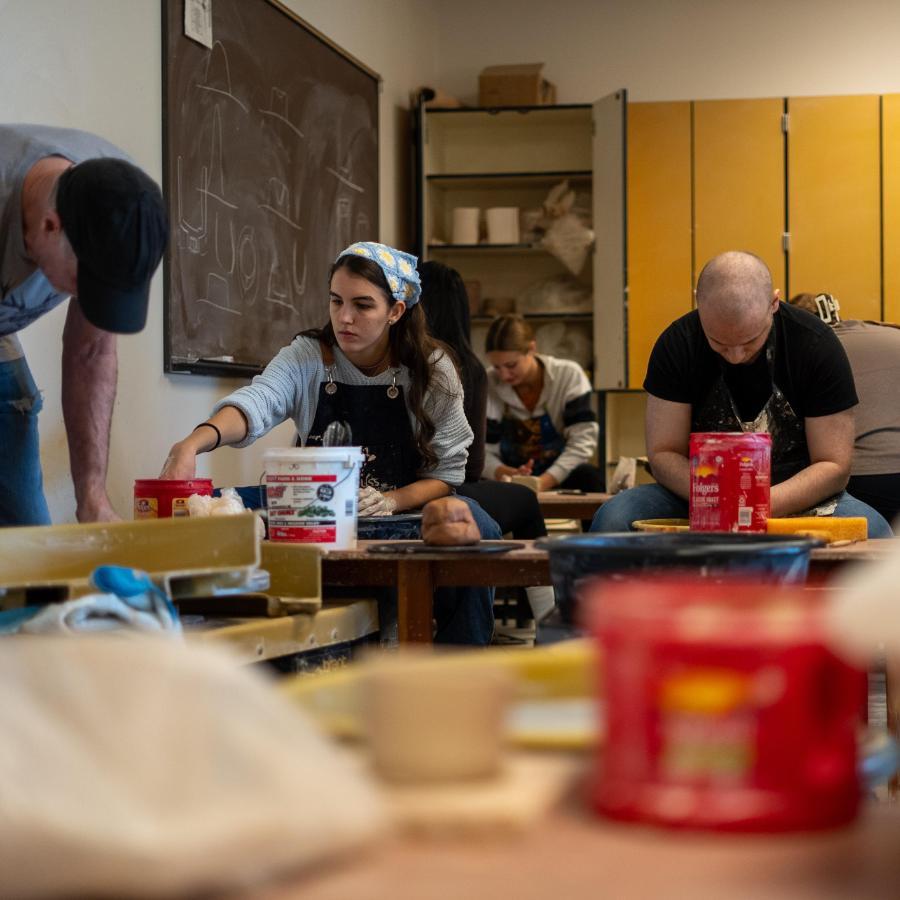 ceramics class students working with clay