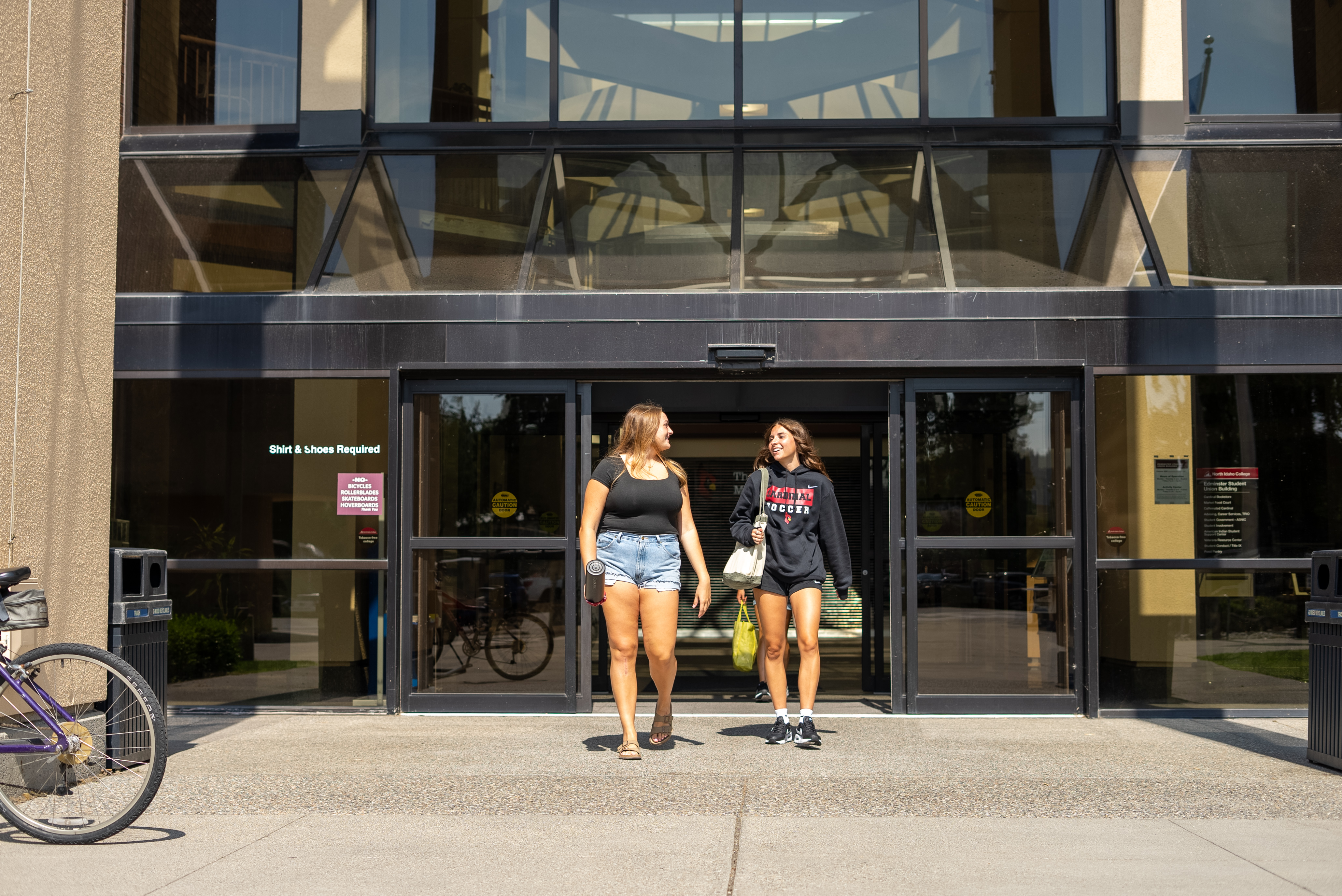 2 female students walking out of SUB