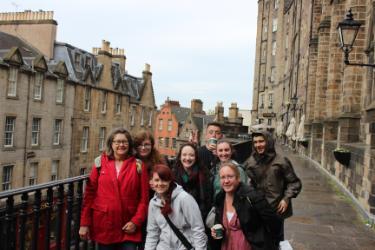 From left, NIC students Peggy Gunther, Victoria Robbins, Mary Cowin, Cassidy Livingston, Josh Imhoff, Nora Kennedy, Diona Morse and Bret Janson pose for a photo during an NIC British Murder Mysteries trip in 2018 at Victoria Terrace in Edinburgh, Scotland.