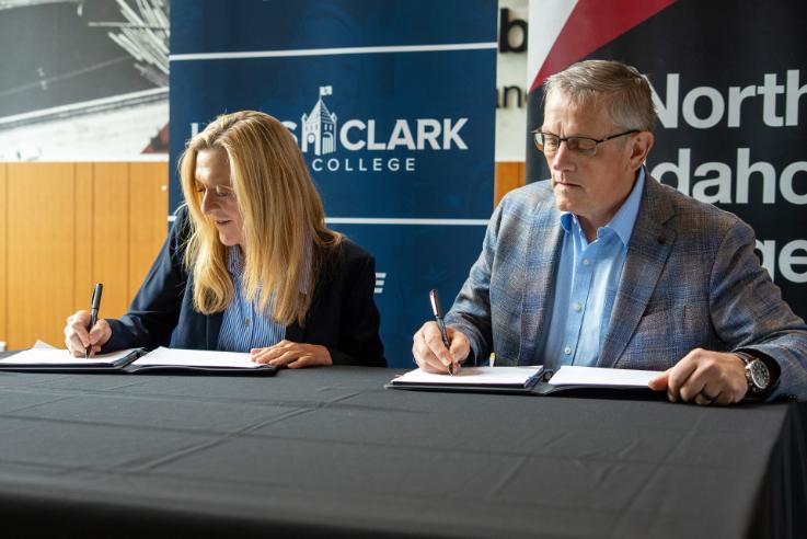 LC State President Cynthia Pemberton, left, and NIC President Nick Swayne sign a memorandum of understanding at a signing ceremony on Thursday, Sept. 10, at the DeArmond Building on NIC’s Coeur d’Alene campus