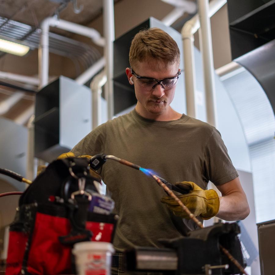 HVAC Class two male students working on hvac system