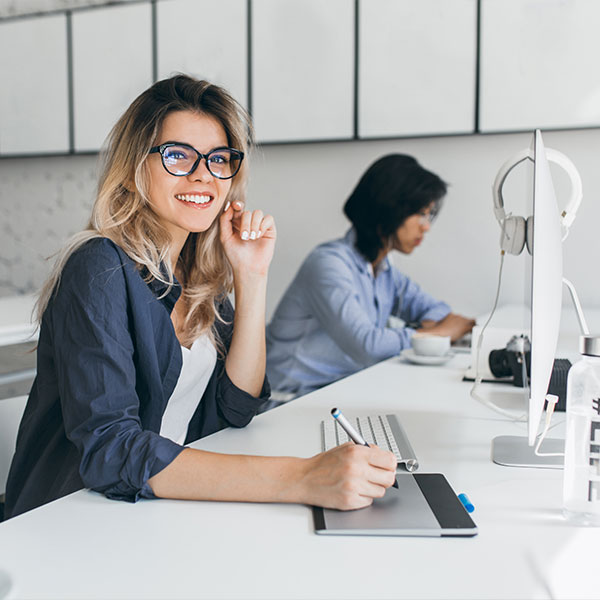 Female sitting at a desk with computer