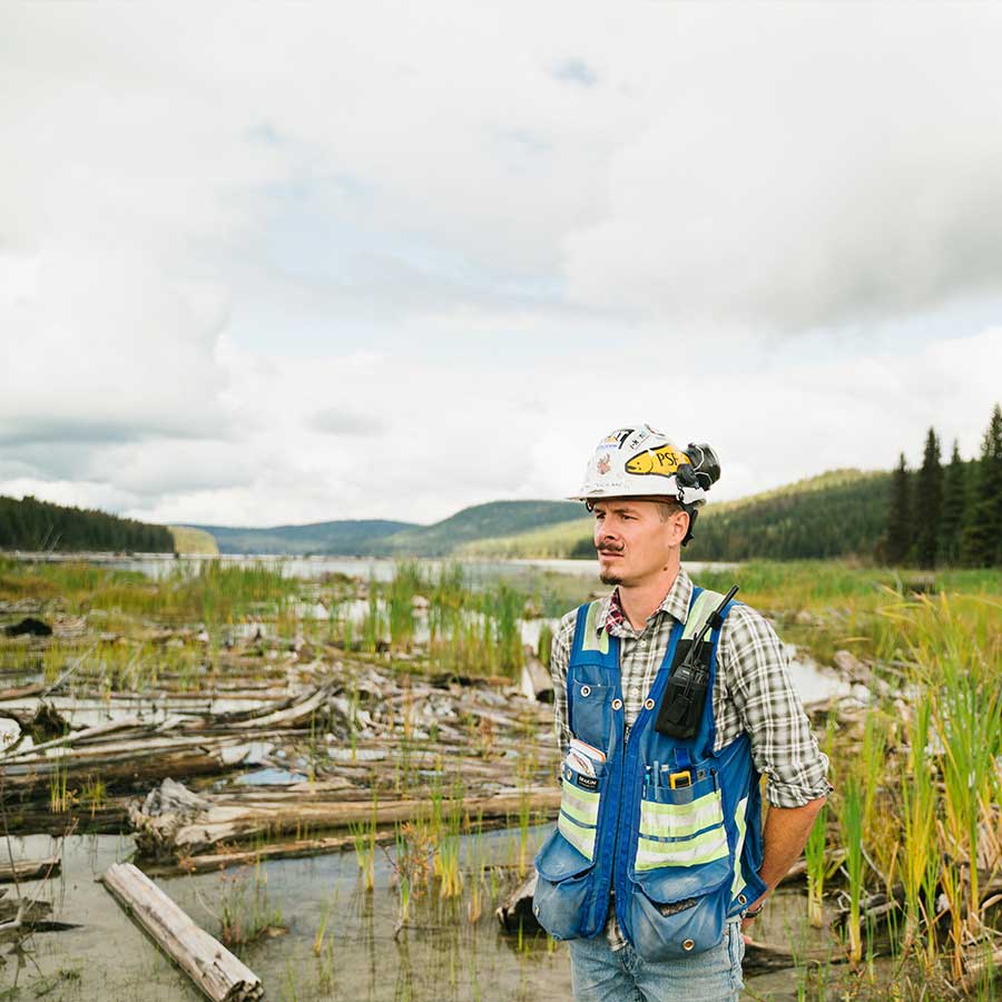 Environmental Scientist in the field with safety hat and gear