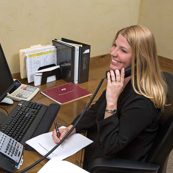 Office specialist answering the phone